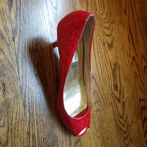 Red quilted peep-toe heels